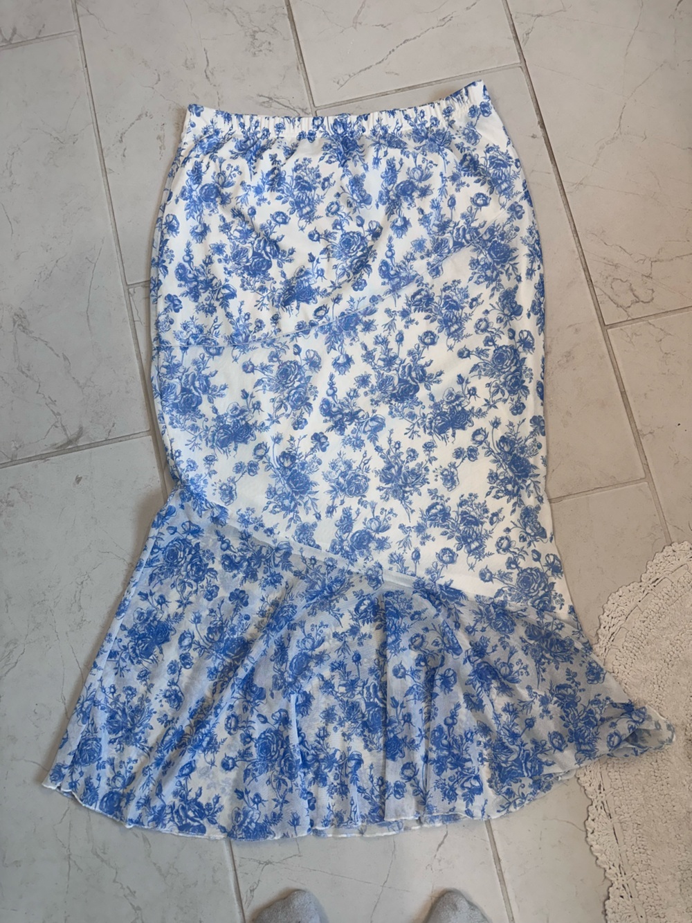 White skirt with blue flower pattern